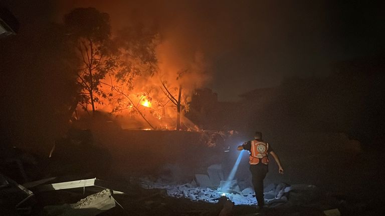 A Palestinian rescuer works at the site of an Israeli strike on a house in Gaza City October 30, 2023. REUTERS/Mutasem Murtaja