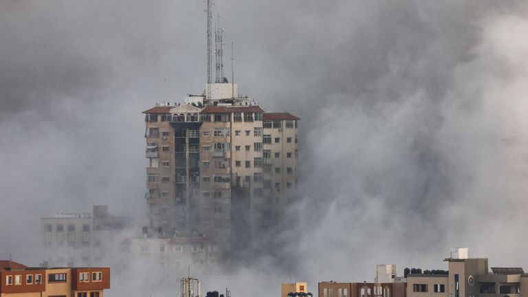 Smoke billows from a building after it was hit by Israeli strikes, in Gaza, October 9, 2023. REUTERS/Mohammed Salem
