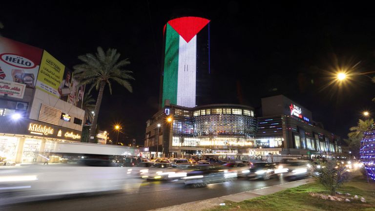 A shopping mall is illuminated with the Palestinian flag in Baghdad in solidarity with Palestinians in Gaza