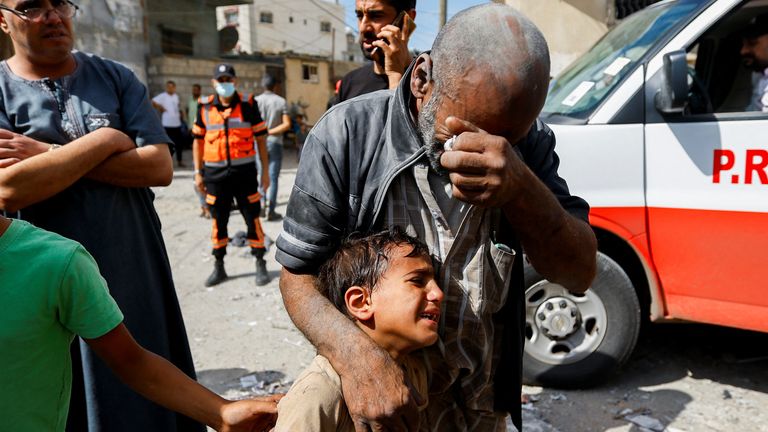 Palestinians react, at the site of Israeli strikes on houses, in Rafah in the southern Gaza Strip 