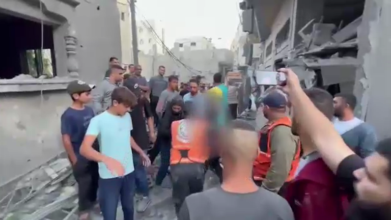 Gaza rubble and dead body blurred