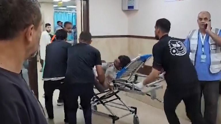 fFootage shows Palestinians injured in Israeli airstrikes being taken to the Al-Aqsa Hospital in the central Gaza Strip.