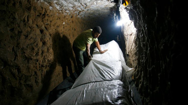 A Palestinian smuggler moves refrigerators through a tunnel from Egypt to the Gaza Strip under the border in Rafah File Pic: AP