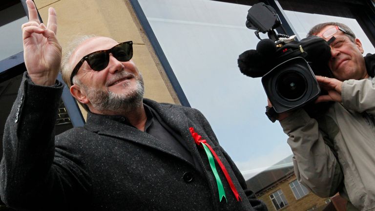 Respect Party candidate George Galloway gestures as he arrives at his campaign office in Bradford, northern England, March 30, 2012. Galloway, an anti-war campaigner in the small, left-wing Respect party, beat Labour&#39;s Imran Hussain in a result announced on Friday with more than 18,341 votes from a by-election on Thursday for the seat of Bradford West. 