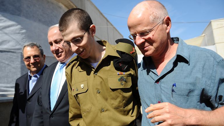 Gilad Shalit and his father Noam are reunited after his release in 2011