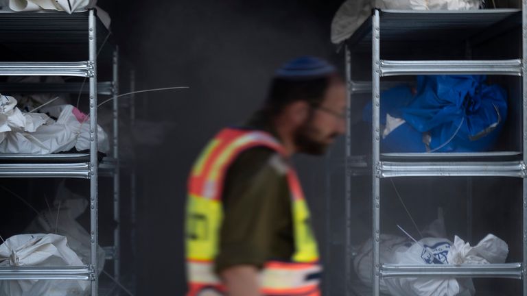 The bodies of Israelis killed in an Hamas militant attack are gathered in refrigerated containers for identification at a military base in Ramla, Israel, on Tuesday Oct. 24, 2023. Official said the 784 bodies have been identitified so far. Israeli officials say More than 1,400 people were killed and over 200 taken captive in Gaza, in the multi-front attack by the Hamas militant group on Oct. 7. (AP Photo/Petros Giannakouris)