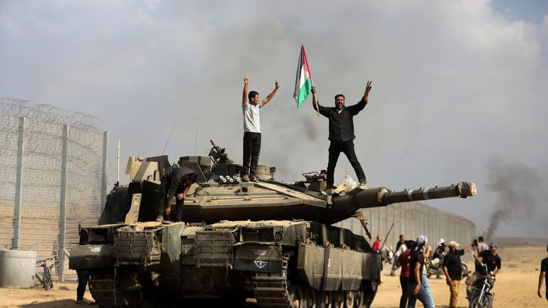 A destroyed Israeli tank at the Gaza Strip fence east of Khan Younis. Pic: AP