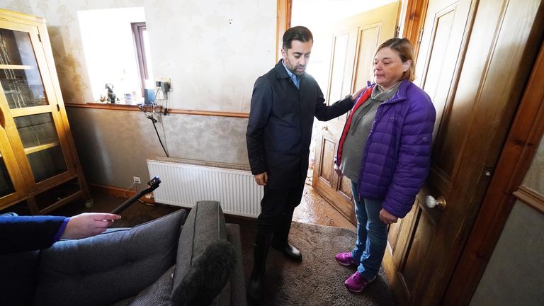 First Minister Humza Yousaf speaks to Kim Clark as he looks at water damage in her house during a visit to Brechin, Scotland, to thank members of the emergency services and Angus Council for their efforts in responding to the flooding caused by Storm Babet. Picture date: Monday October 23, 2023. PA Photo. See PA story WEATHER Babet. Picture credit should read: Andrew Milligan/PA Wire