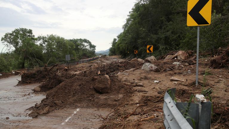 View of a road en route to Acapulco blocked with debris due to a landslide after Hurricane Otis hit, in the Mexican state of Guerrero, Mexico October 25, 2023. REUTERS/Henry Romero. 