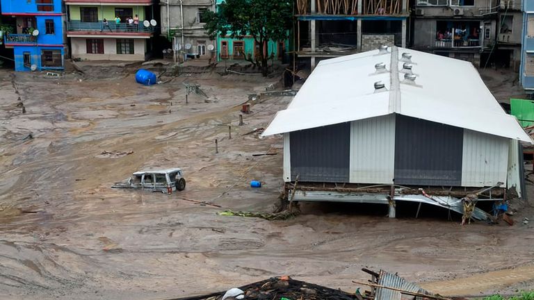 A vehicle is seen partially submerged in water after flash floods triggered by a sudden heavy rainfall swamped the Rangpo town in Sikkim, India, Thursday, Oct.5. 2023. The flooding took place along the Teesta River in the Lachen Valley of the north-eastern state, and was worsened when parts of a dam were washed away. (AP Photo/Prakash Adhikari)