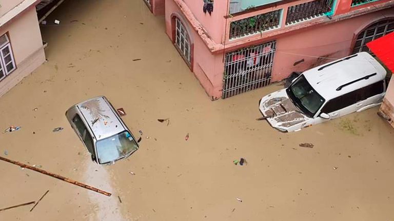 Cars lie submerged in water after flash floods triggered by a sudden heavy rainfall swamped the Rangpo town in Sikkim, India, Thursday, Oct.5. 2023. The flooding took place along the Teesta River in the Lachen Valley of the north-eastern state, and was worsened when parts of a dam were washed away. (AP Photo/Prakash Adhikari)