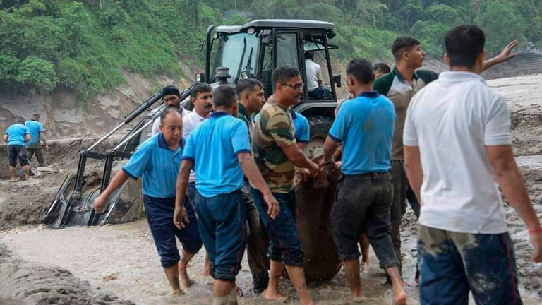Rescue work continues after flash floods triggered by a sudden heavy rainfall swamped the Rangpo town in Sikkim, India, Thursday, Oct.5. 2023. The flooding took place along the Teesta River in the Lachen Valley of the north-eastern state, and was worsened when parts of a dam were washed away. (AP Photo/Prakash Adhikari)