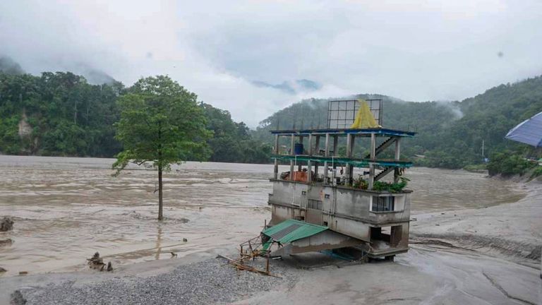 A building stands inundated after flash floods triggered by a sudden heavy rainfall swamped the Rangpo town in Sikkim, India, Thursday, Oct.5. 2023. The flooding took place along the Teesta River in the Lachen Valley of the north-eastern state, and was worsened when parts of a dam were washed away. (AP Photo/Prakash Adhikari)