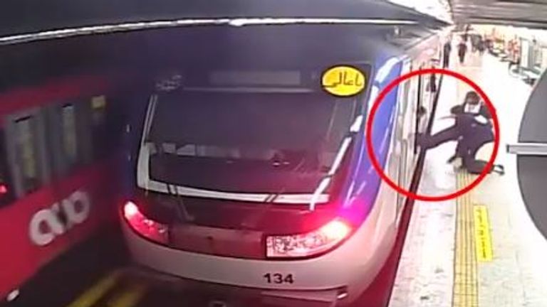 CCTV footage - which has not been independently verified - shared by news agency IRNA appears to show Amrita Geravand being dragged out of the train. Pic: IRNA