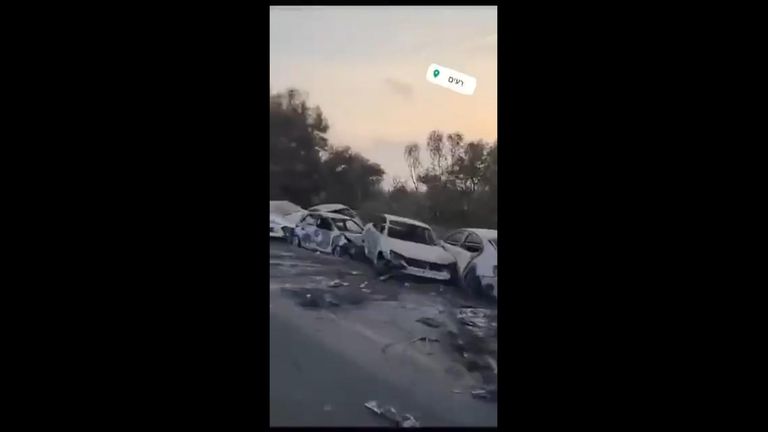 Social media footage of burned out cars along a road near the festival site
