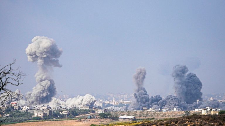Smoke rises following an Israeli airstrike in the Gaza Strip, as seen from southern Israel 
Pic:AP