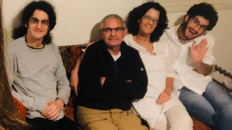 Nadav Kipnis, shows him, at right, sitting with his family, from left, his brother Yotam Kipnis, his father Eviatar Moshe Kipnis 65 and his mother Lilach Lea Havron 60.  (Kipnis Family via AP)