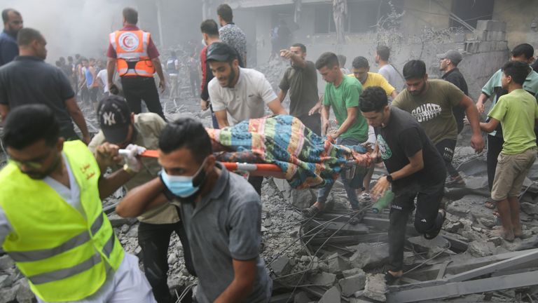 Palestinians evacuate the wounded after an Israeli airstrike in Rafah refugee camp, southern Gaza Strip. Pic: AP