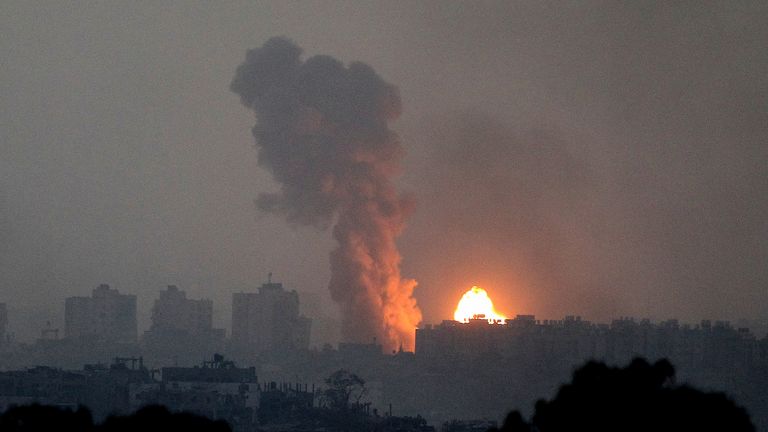 Fire and smoke rise following an Israeli airstrike in the Gaza Strip, as seen from southern Israel, Saturday, Oct. 28, 2023. (AP Photo/Ilan Assayag)