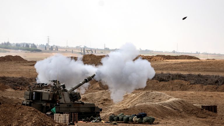 An Israeli tank fires near Israel's border with the Gaza Strip