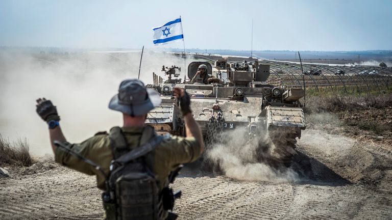 Israeli military combat vehicles and tanks near the Israeli-Gaza border. Pic: AP