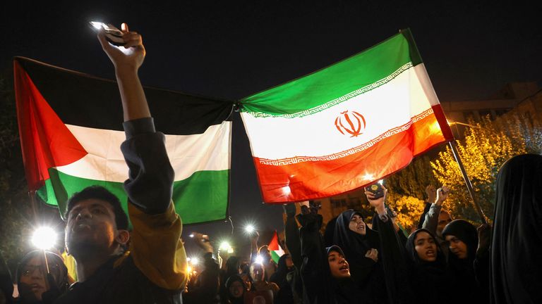 Protesters chant slogans during an anti-Israel protest in front of the British embassy in Tehran