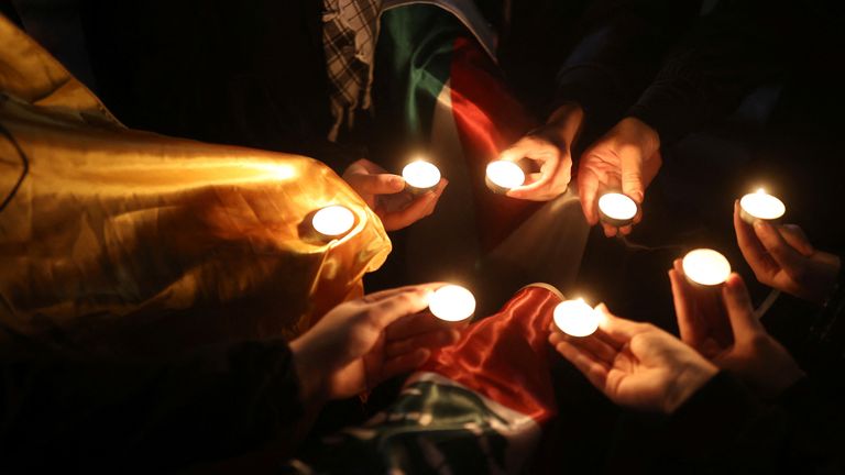 Supporters of Palestine light candles during a gathering in support of Palestinians, in Tehran