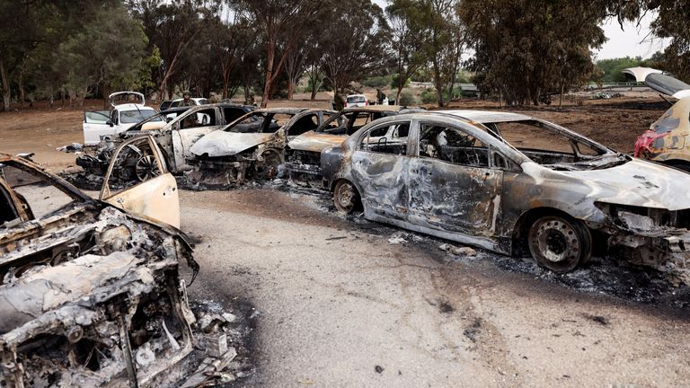 Burnt cars are abandoned in a carpark near where a festival was held before an attack by Hamas gunmen from Gaza that left at least 260 people dead, by Israel&#39;s border with Gaza in southern Israel, October 10, 2023. REUTERS/Ronen Zvulun