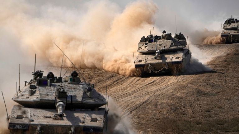 Israeli tanks head towards the Gaza Strip border. Pic: AP