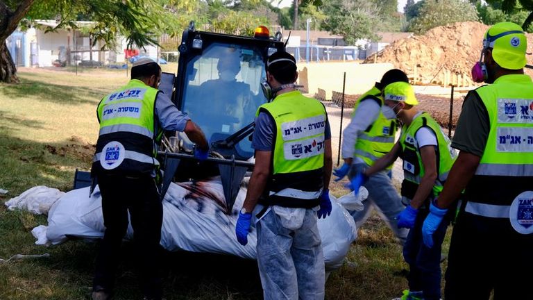 The attackers are placed in body bags and marked with an X