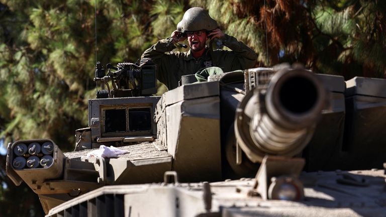 An Israeli soldier sits in a tank near Israel's border with Lebanon, in northern Israel, October 25, 2023. REUTERS/Lisi Niesner
