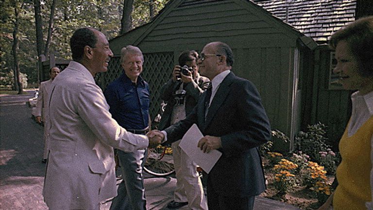 Egyptian President Anwar Sadat and Israeli Prime Minister Menachem Begin greet each for their first meeting at the Camp David Summit as Jimmy Carter and Rosalynn Carter watch at Camp David, Maryland, September 7, 1978. Courtesy Jimmy Carter Library/National Archives/Handout via REUTERS ATTENTION EDITORS - THIS IMAGE WAS PROVIDED BY A THIRD PARTY REFILE - CORRECTING YEAR
