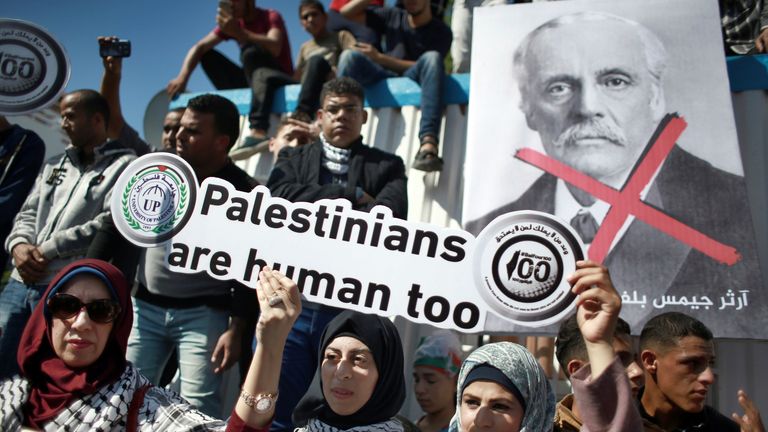 Palestinians protest in front of the Office of the United Nations Special Coordinator for the Middle East Peace Process headquarters, marking the 100th anniversary of the Balfour Declaration, in Gaza City, Thursday, Nov. 2, 2017. The Balfour Declaration, Britain&#39;s promise in 1917 to Zionists to create a Jewish home in what is now Israel, turns 100 this week. (AP Photo/ Khalil Hamra)


