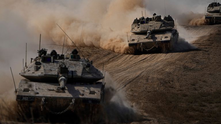 Israeli tanks head towards the Gaza Strip border in southern Israel. Pic: AP