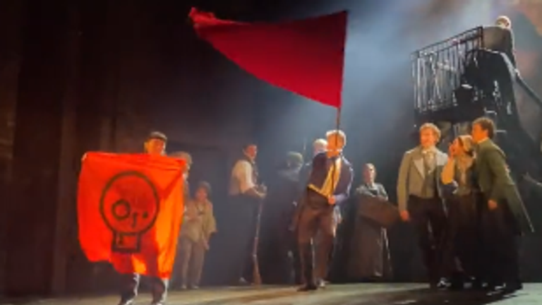 Just Stop Oil protesters storm the stage at the Sondheim Theatre in the West End. Pic: Just Stop Oil