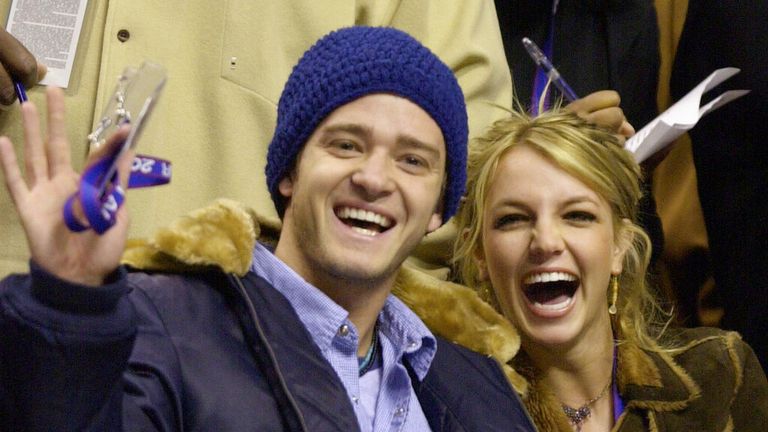 FILE - In this Feb. 10, 2002, file photo, Justin Timberlake and Britney Spears wave to the crowd prior to the start of the 2002 NBA All-Star game in Philadelphia. Timberlake told E! News on Sept. 13, 2016, that he&#39;s open to collaborating with Spears. Spears mentioned Timberlake last month in answering a question about who she would like to work with one day. (AP Photo/Chris Gardner, File)