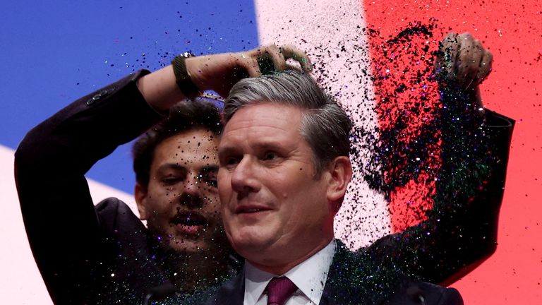 A protester throws confetti on Britain's Labour Party Leader Keir Starmer at Britain's Labour Party annual conference in Liverpool, Britain, October 10, 2023. REUTERS/Phil Noble TPX IMAGES OF THE DAY