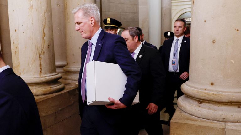 Former Speaker of the House Kevin McCarthy (R-CA) carries a box as he leaves the office of the Speaker of the House and heads out of the U.S. Capitol several hours after being ousted from the position of Speaker by a vote of the House of Representatives on Capitol Hill in Washington, U.S. October 3, 2023. REUTERS/Jonathan Ernst