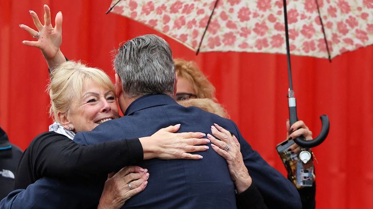 Well-wishers embrace Kier Starmer, leader of Britain&#39;s Labour Party, as he attends a by-election victory event for Sarah Edwards, newly elected MP for Tamworth, at Tamworth football stadium, Tamworth in central Britain, October 20, 2023. REUTERS/Toby Melville.