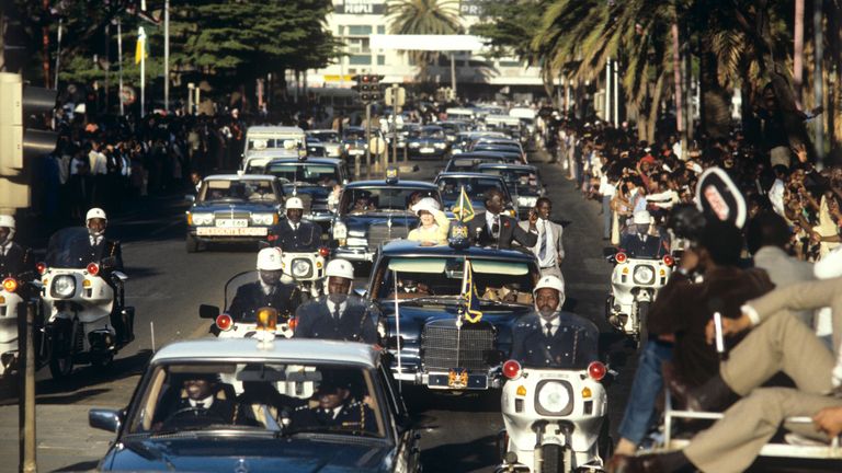 Queen Elizabeth II travelling via motorcade to the city from Jomo Kenyatta International Airport, during a state visit to Kenya in 1983