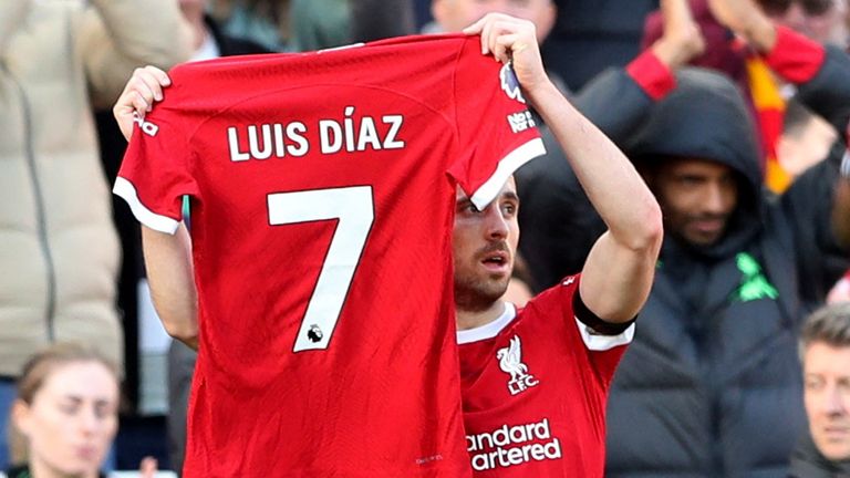Liverpool's Diogo Jota holds up a shirt in support of Diaz during their match against Nottingham Forest 