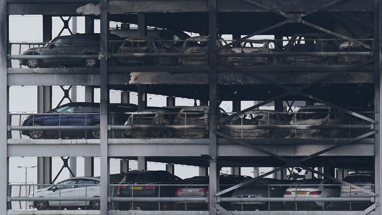 The burnt out shells of cars, buried amongst debris of a multi-storey car park at Luton Airport, which has been closed with flights suspended until at least 3pm on Wednesday, after a fire ripped through the car park causing it to collapse. The fire was declared a major incident, with firefighters working through the night and into the early hours of Wednesday to extinguish the blaze. Picture date: Wednesday October 11, 2023.