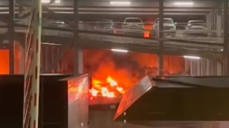 Part of a multi-storey car park collapses at Luton Airport during a fire