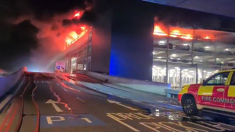 Handout screen grab from video issued by Bedfordshire Fire and Rescue Service a fire at a car park at Luton Airport On Tuesday. All flights at the airport have been suspended. Issue date: Wednesday October 11, 2023.