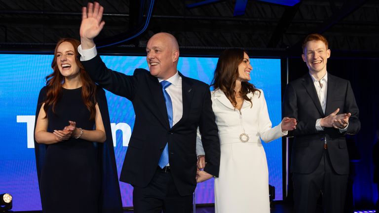 Christopher Luxon celebrates with his wife Amanda, left, and children Olivia and William, right. Pic: AP