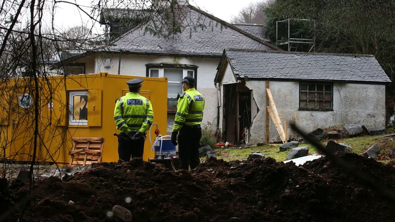Police search a cottage and its grounds where Margaret Fleming lived in Inverkip, as they investigate the disappearance of the vulnerable woman last seen in public 17 years ago.