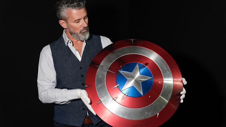 Propstore CEO Stephen Lane holds Chris Evans&#39; Captain America shield from the 2011 film &#39;Captain America: The First Avenger&#39; (estimate £50,000 - 100,000) during a preview for the showbiz memorabilia auction, at the Propstore in Rickmansworth, Hertfordshire. Picture date: Wednesday September 20, 2023.