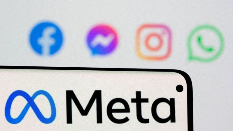 FILE PHOTO: Facebook&#39;s new rebrand logo Meta is seen on smartphone in front of displayed logo of Facebook, Messenger, Instagram, Whatsapp and Oculus in this illustration picture taken October 28, 2021. REUTERS/Dado Ruvic/Illustration/File Photo