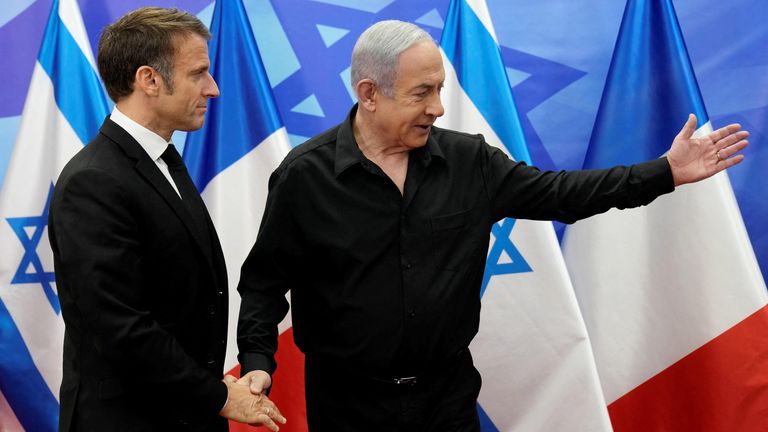 Israeli Prime Minister Benjamin Netanyahu, right, welcomes French President Emmanuel Macron before their talks in Jerusalem 