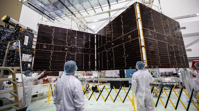 Technicians begin to retract one of the two solar arrays attached to NASA&#39;s Psyche spacecraft. Pic: NASA/Kim Shiflett